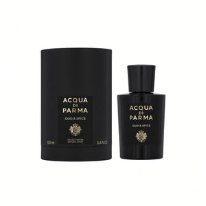 Acqua di Parma Oud & Spice eau de parfum shown with a black cylindrical box and a matching black bottle, both featuring gold lettering and a crest logo, on a plain white background.