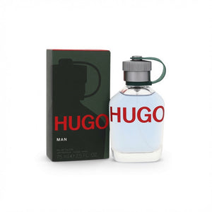 Hugo Man Eau de Toilette bottle and packaging box on a white background. The bottle is clear glass with a light blue liquid and a dark green cap loop, while the box is dark green with a silhouette and bold red 'HUGO' text.